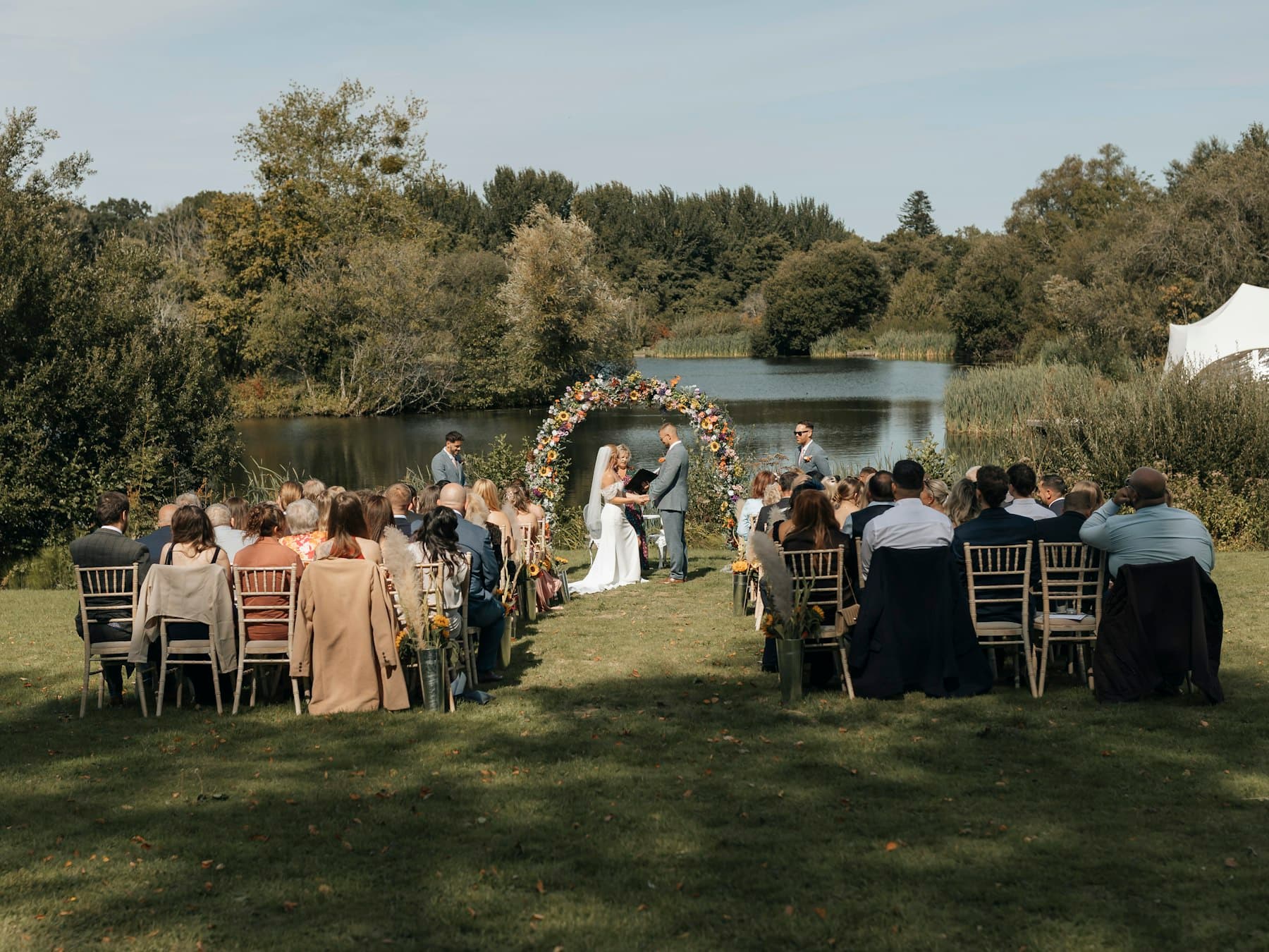 A ceremony gathered beside the water