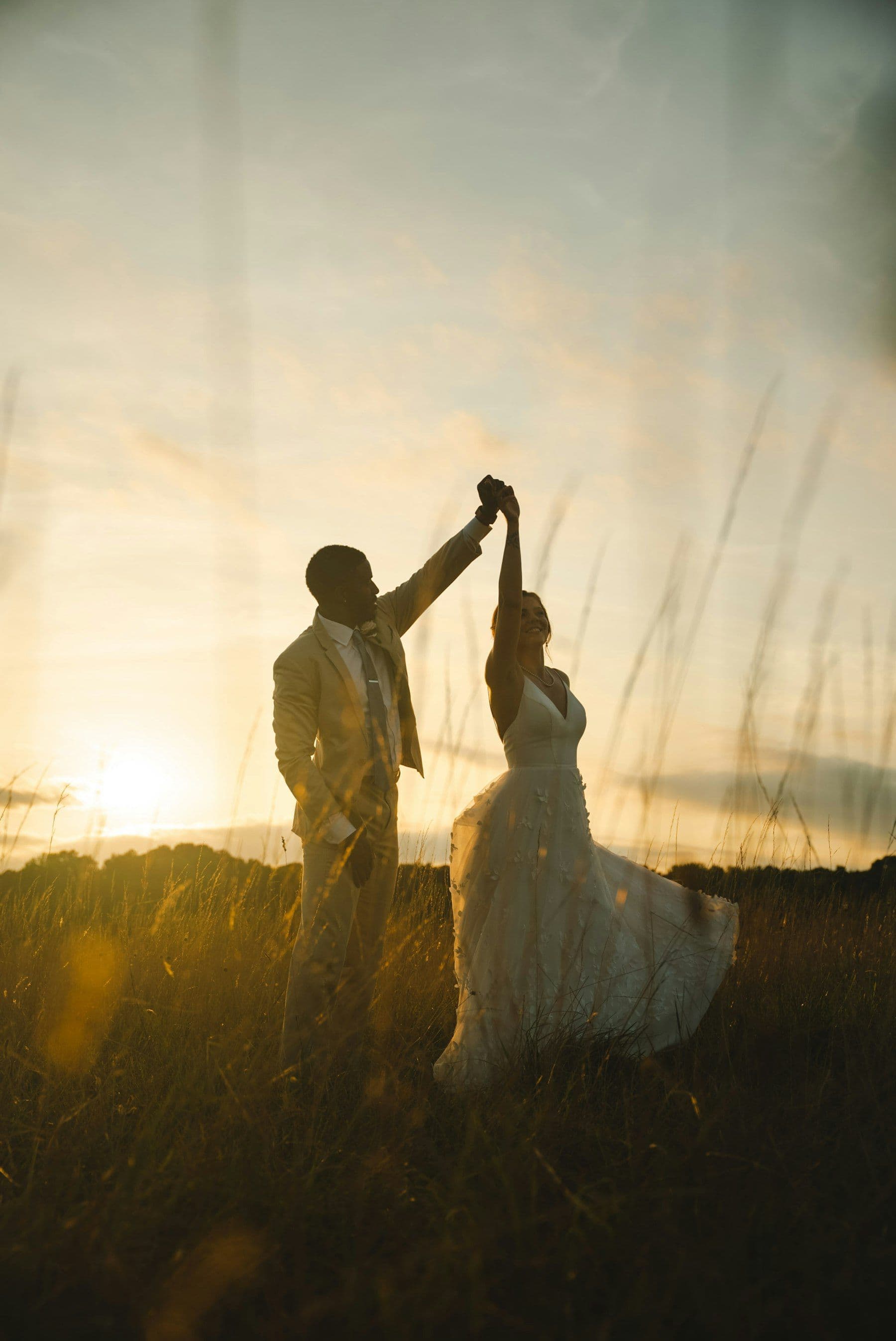 The couple turning together in the last light