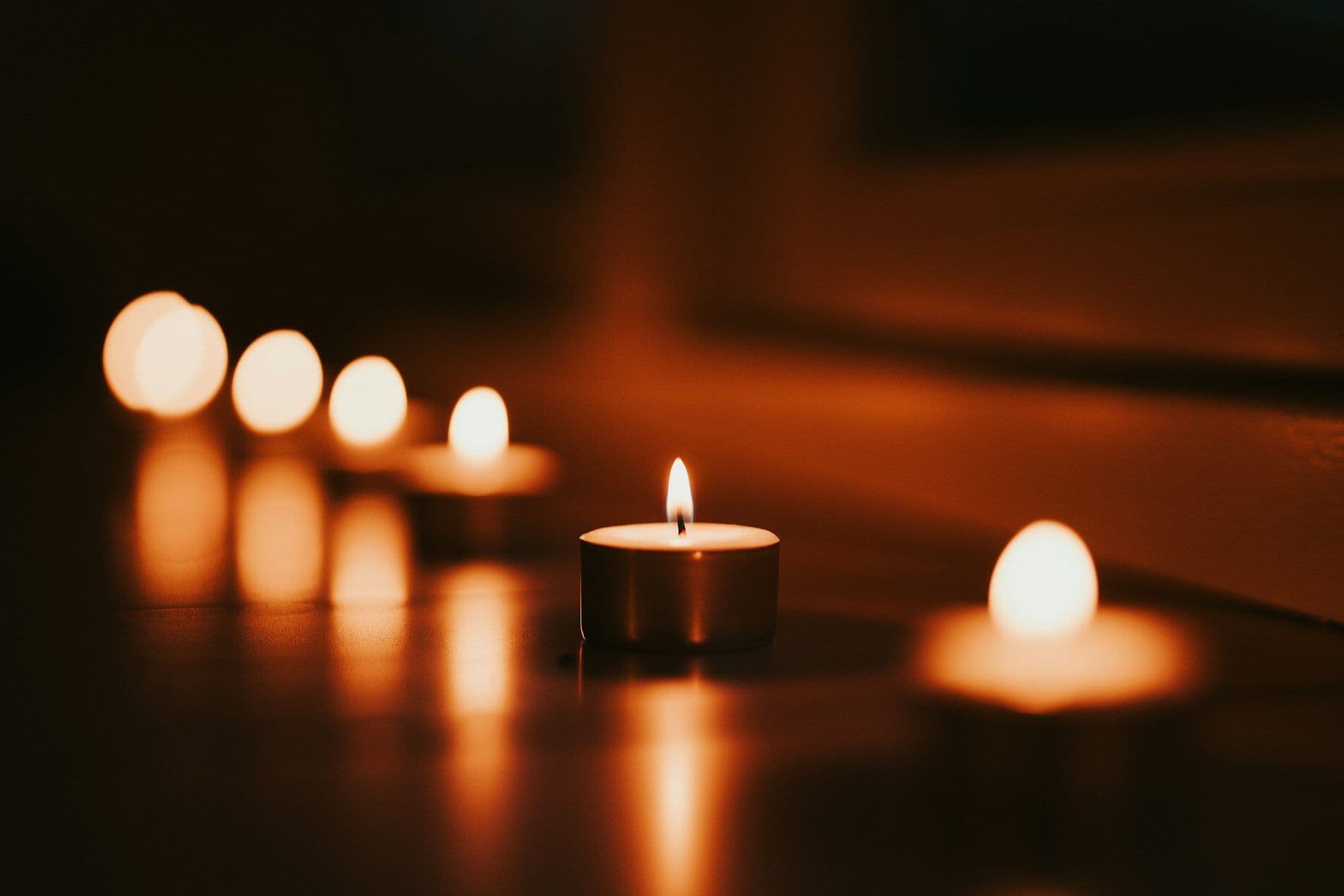 Candles burning low in the evening air