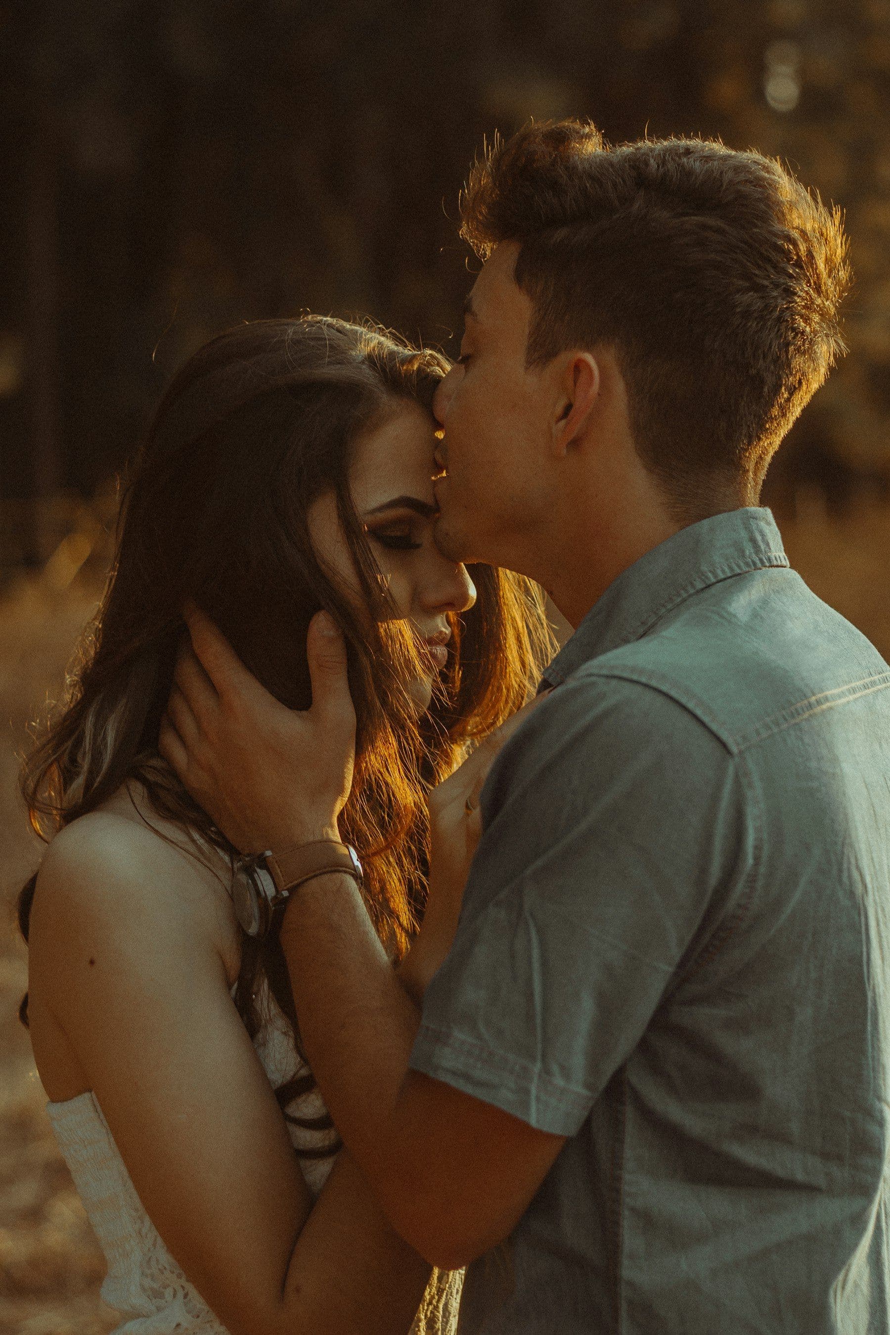 A kiss to the forehead in the last warm light