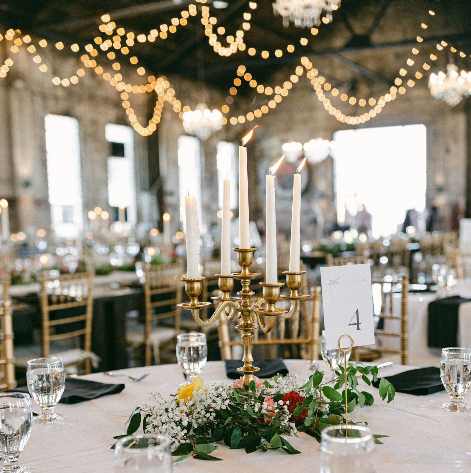 The long table set under chandeliers